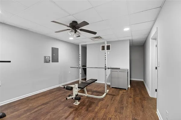 a room with wooden floor and white walls