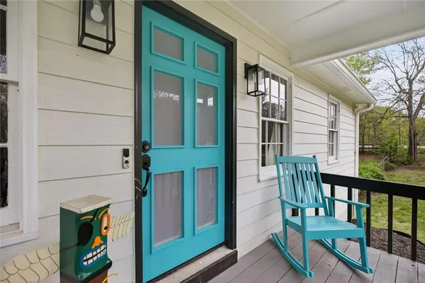 a view of front door of house with stairs