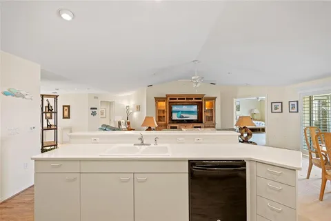 a kitchen with stainless steel appliances a refrigerator and a stove top oven