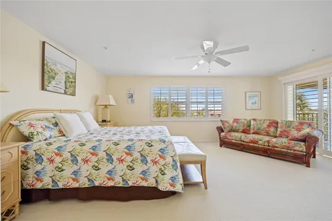 a bathroom with a granite countertop sink a toilet and a mirror