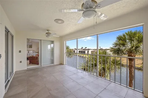 an aerial view of residential houses with outdoor space and lake view