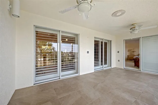 an aerial view of residential houses with outdoor space and ocean view