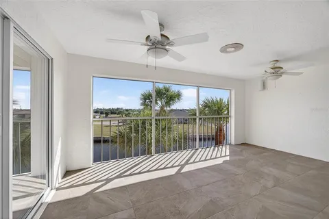 an aerial view of residential houses with outdoor space and lake view