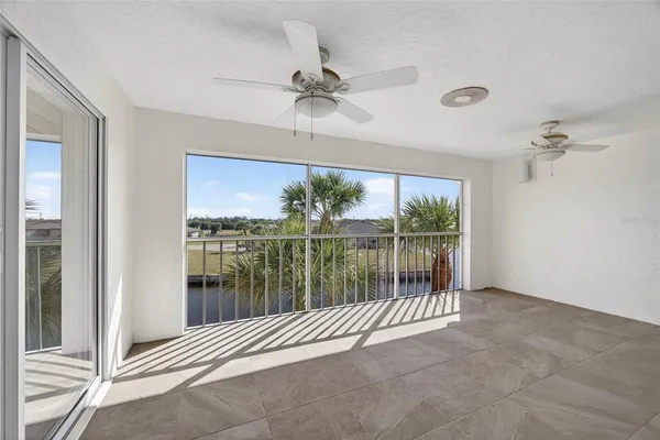 an aerial view of residential houses with outdoor space and lake view