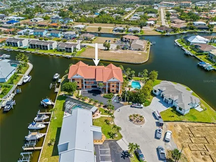 an aerial view of a house with a ocean view