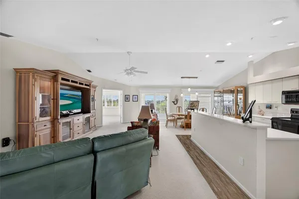 a living room with furniture fireplace and a flat screen tv