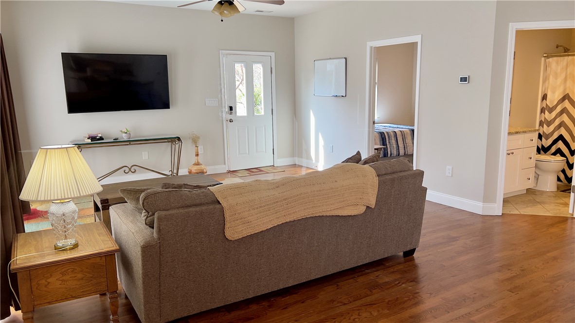 160 Hudgins Lake Road Townville, SC 29689 - Photo 31 of 41 Rich hardwood floors create a welcoming ambiance in this inviting living space.