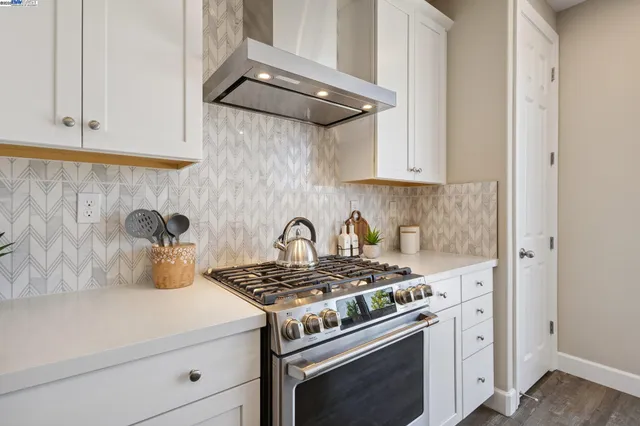 a view of a kitchen counter top space a sink and appliances