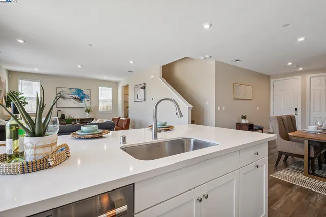a living room with furniture a couch and a window
