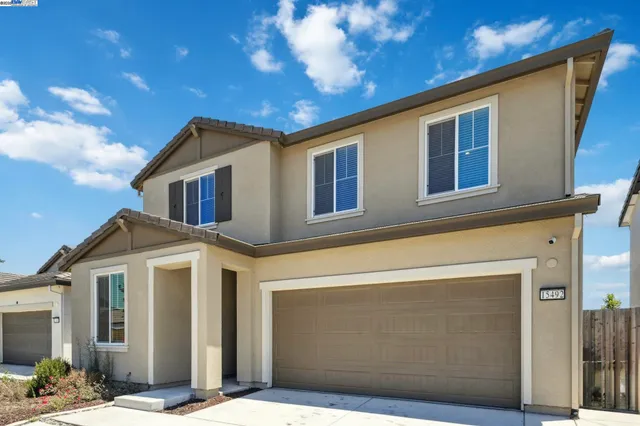 a front view of a house with a garage