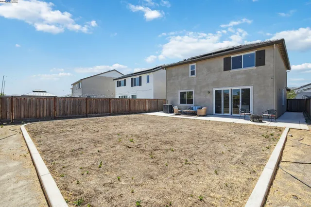 an aerial view of a houses with a city view