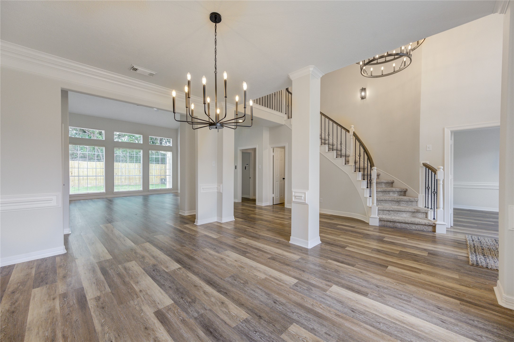 17318 Bonnard Circle Spring, TX 77379 - Photo 3 of 45 Another view of the formal dining room, foyer, stairs and the formal living room in the distant. The home is open and airy with plenty of natural light!