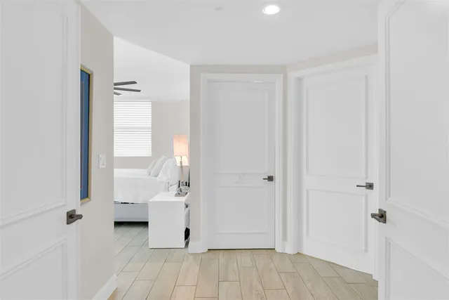 a view of a room with white walls and windows