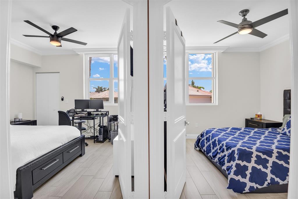 3700 South Ocean Boulevard, Unit 206 Highland Beach, FL 33487 - Photo 17 of 31 a bedroom with a bed and wooden floor