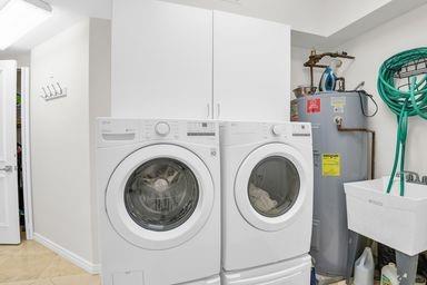 3700 South Ocean Boulevard, Unit 206 Highland Beach, FL 33487 - Photo 24 of 31 a utility room with dryer and washer