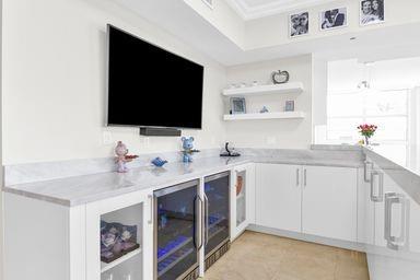 3700 South Ocean Boulevard, Unit 206 Highland Beach, FL 33487 - Photo 10 of 31 a kitchen with a sink and a stove top oven