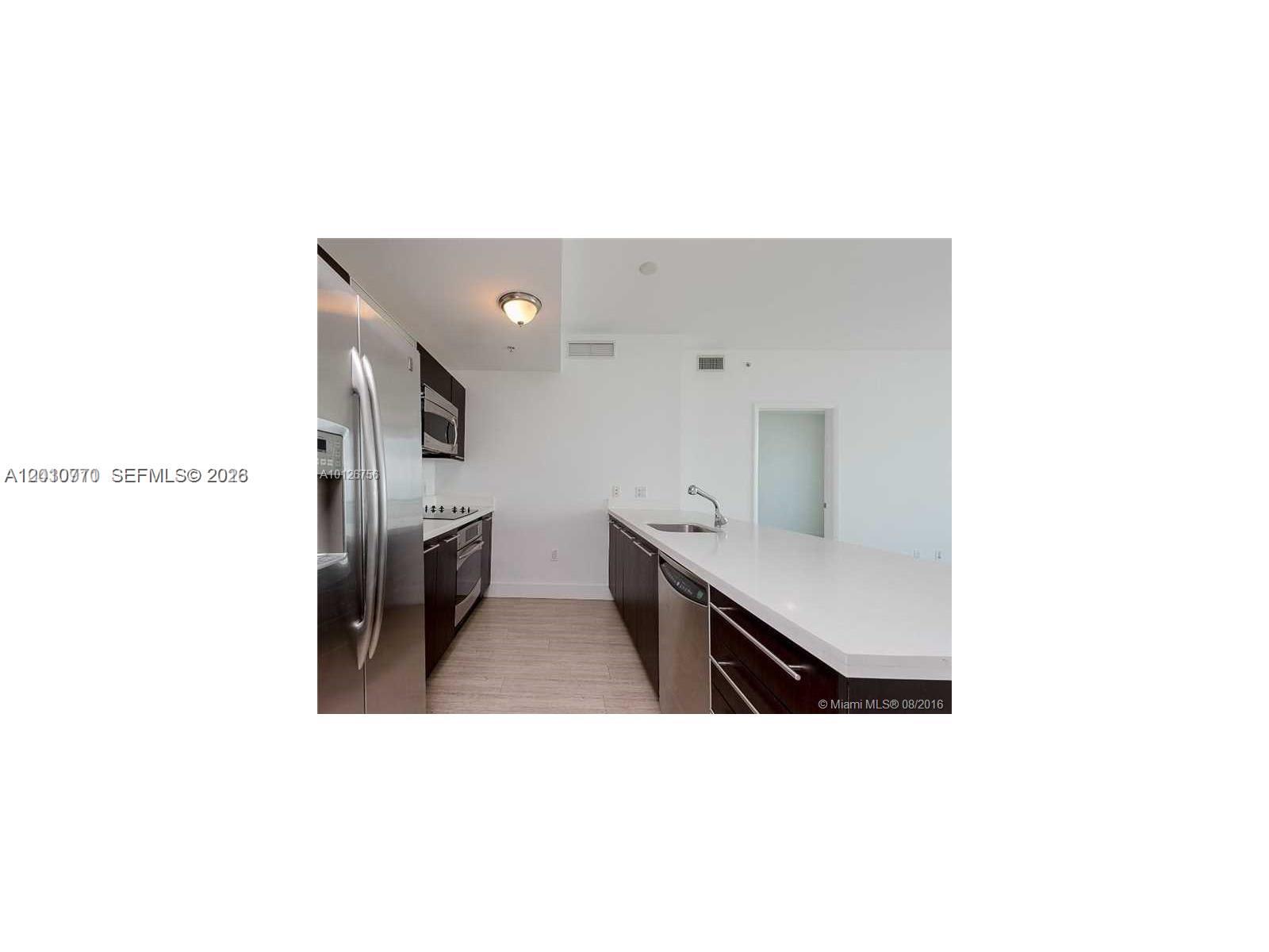 90 Southwest 3rd Street, Unit 2609 Miami, FL 33130 - Photo 3 of 12 a upper view of a living room with furniture and a mirror