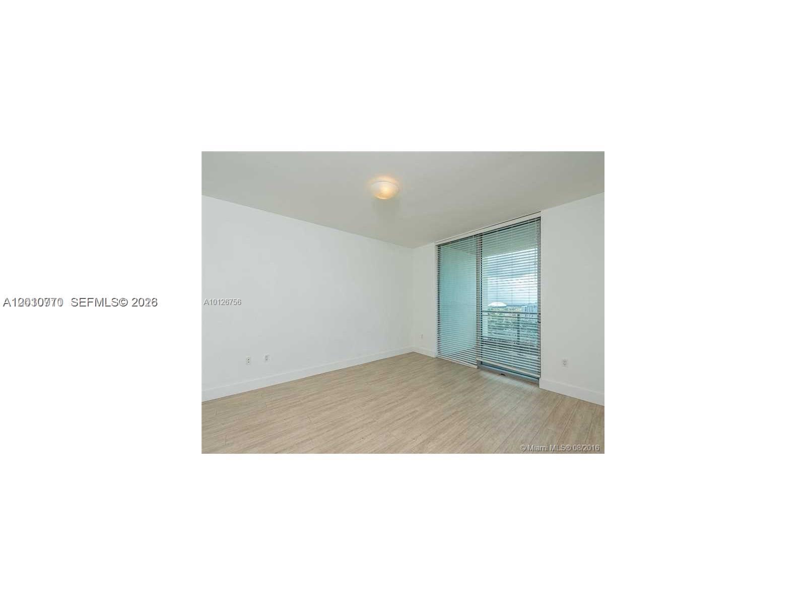 90 Southwest 3rd Street, Unit 2609 Miami, FL 33130 - Photo 6 of 12 a open living room with a bench
