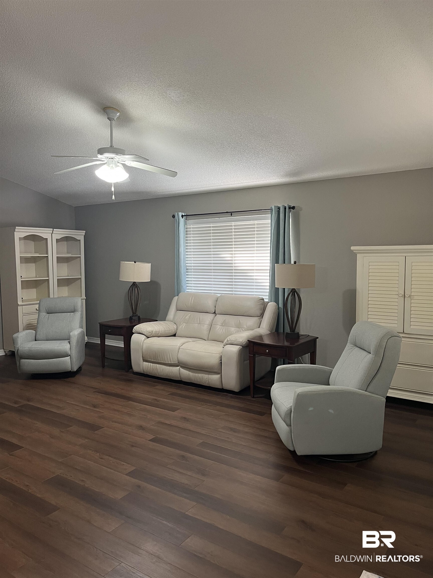 309 Cluster Street Foley, AL 36535 - Photo 9 of 38 Spacious room featuring wood-finish flooring, a ceiling fan, and window with blinds