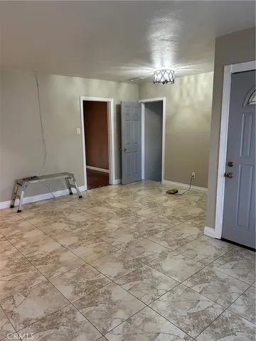 a view of a hallway with a chandelier