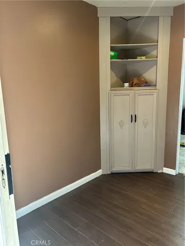 an empty room with wooden floor