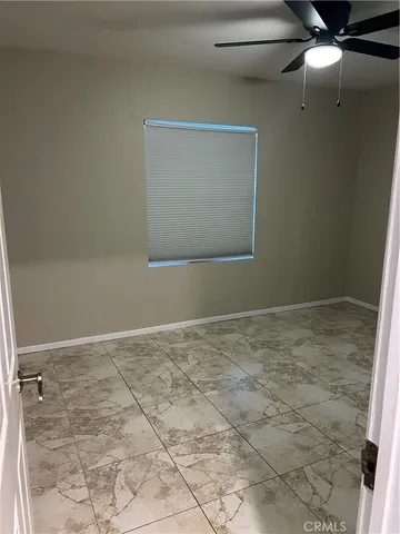 a view of a refrigerator in a bathroom
