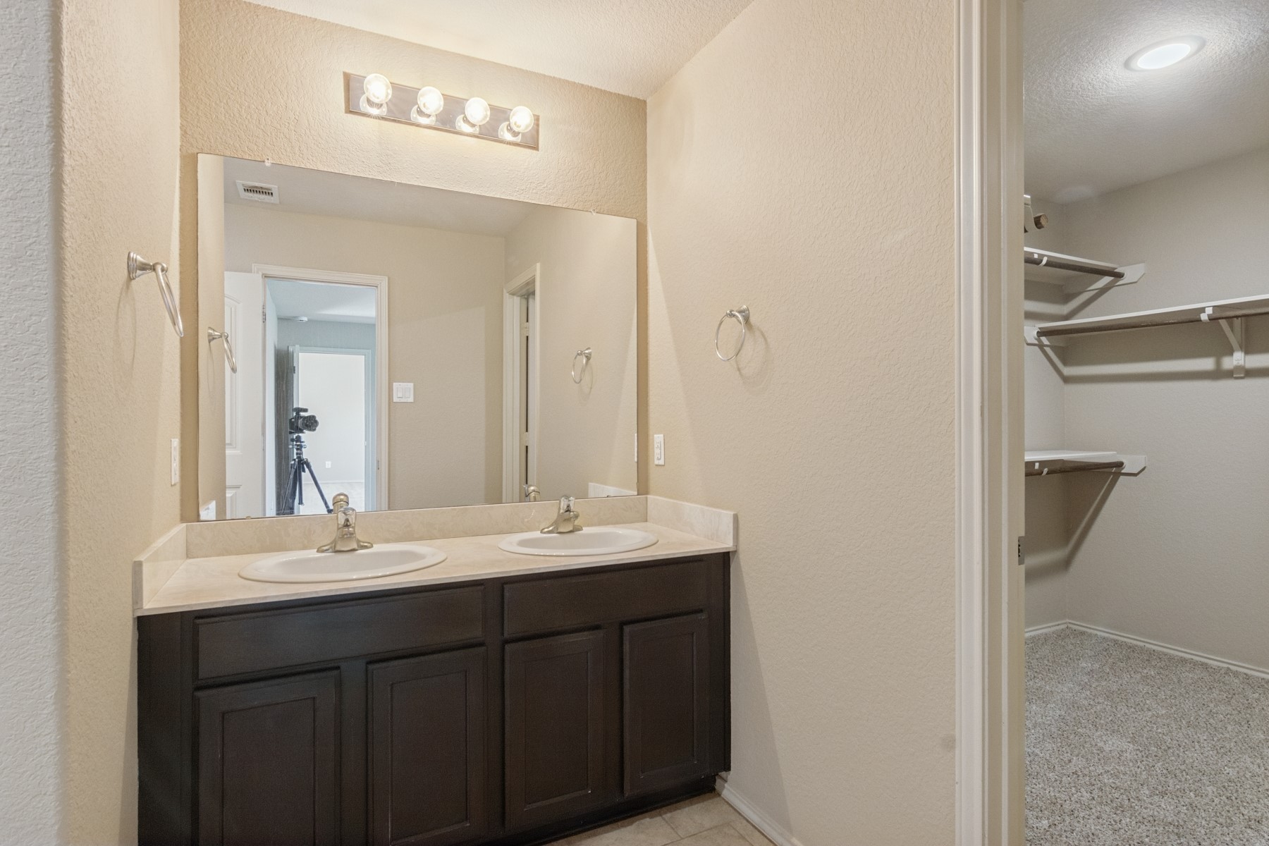 23330 Brat Pass Drive Spring, TX 77373 - Photo 17 of 28 a bathroom with a double vanity sink and a mirror