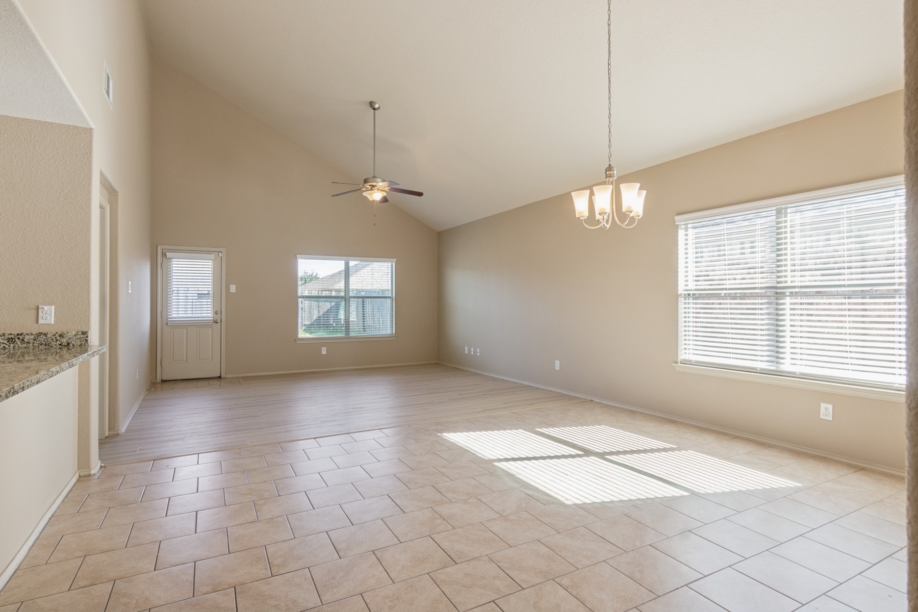 23330 Brat Pass Drive Spring, TX 77373 - Photo 7 of 28 a view of an empty room with window and chandelier fan