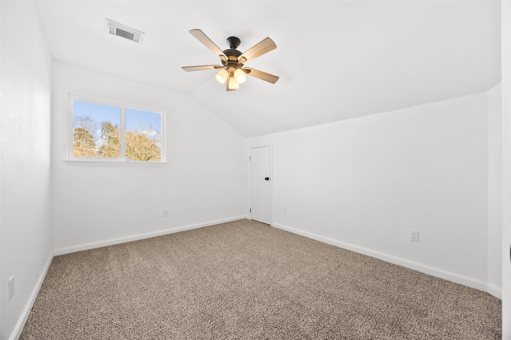 22101 Diane Drive Spring, TX 77373 - Photo 12 of 24 an empty room with a chandelier fan and closet
