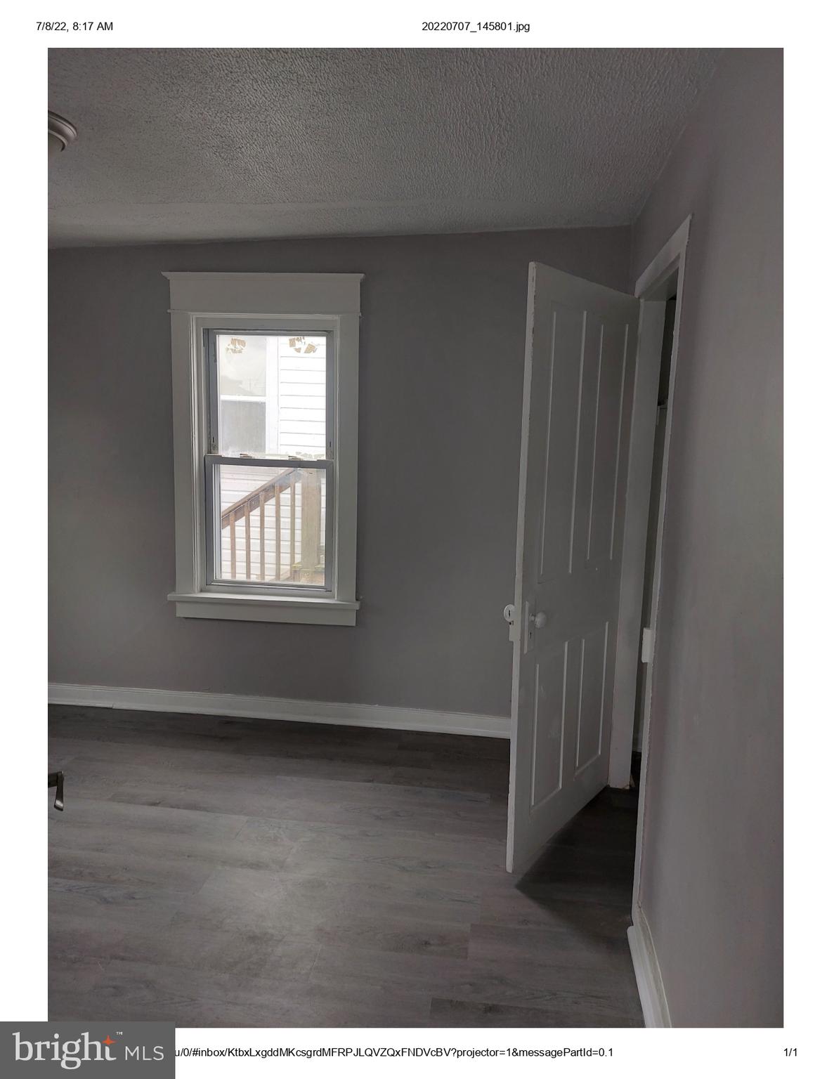1 Madison Avenue, Unit B Mount Holly, NJ 08060 - Photo 11 of 15 a view of an empty room with wooden floor and a window