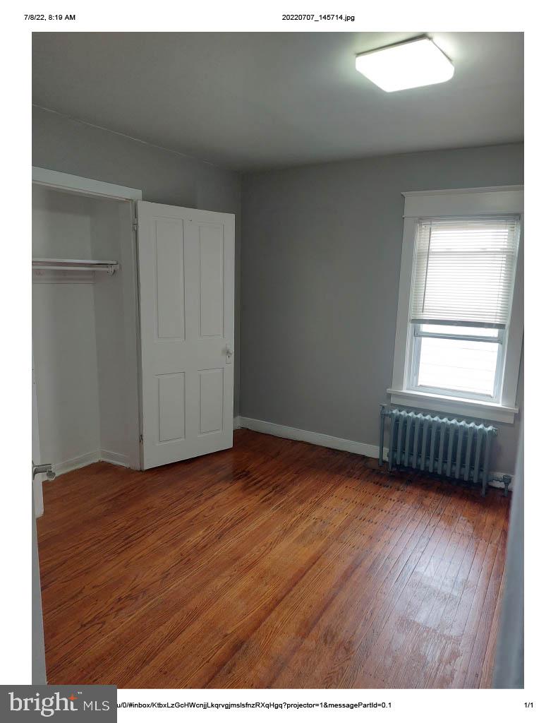 1 Madison Avenue, Unit B Mount Holly, NJ 08060 - Photo 12 of 15 a view of an empty room with wooden floor and a window