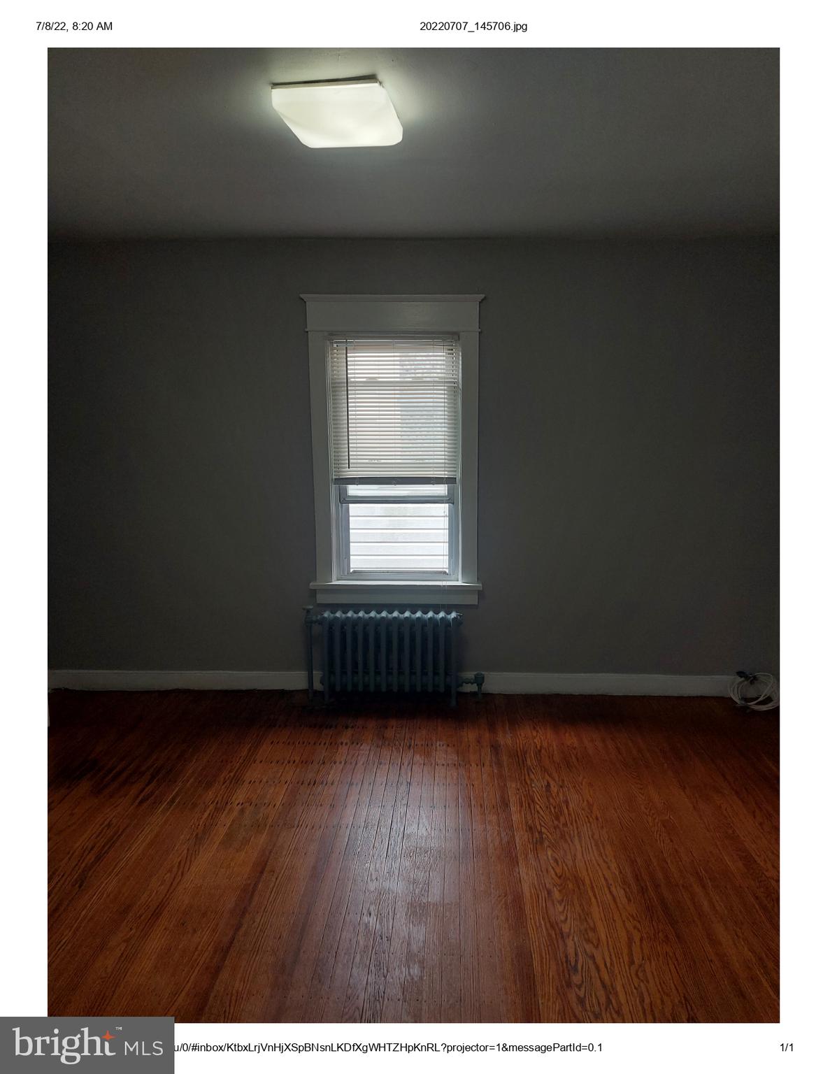 1 Madison Avenue, Unit B Mount Holly, NJ 08060 - Photo 13 of 15 a view of an empty room with wooden floor and a window