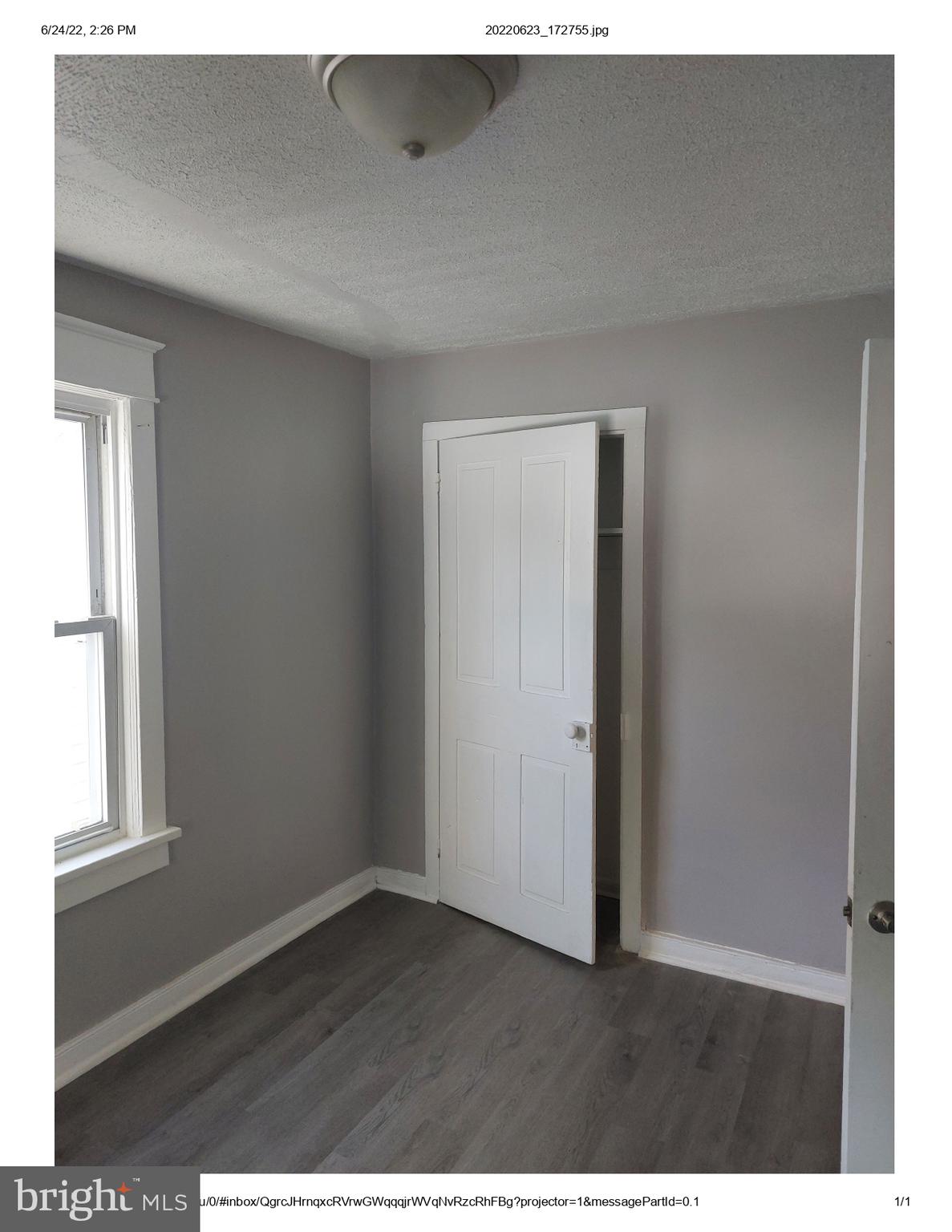 1 Madison Avenue, Unit B Mount Holly, NJ 08060 - Photo 4 of 15 a view of an empty room and wooden floor