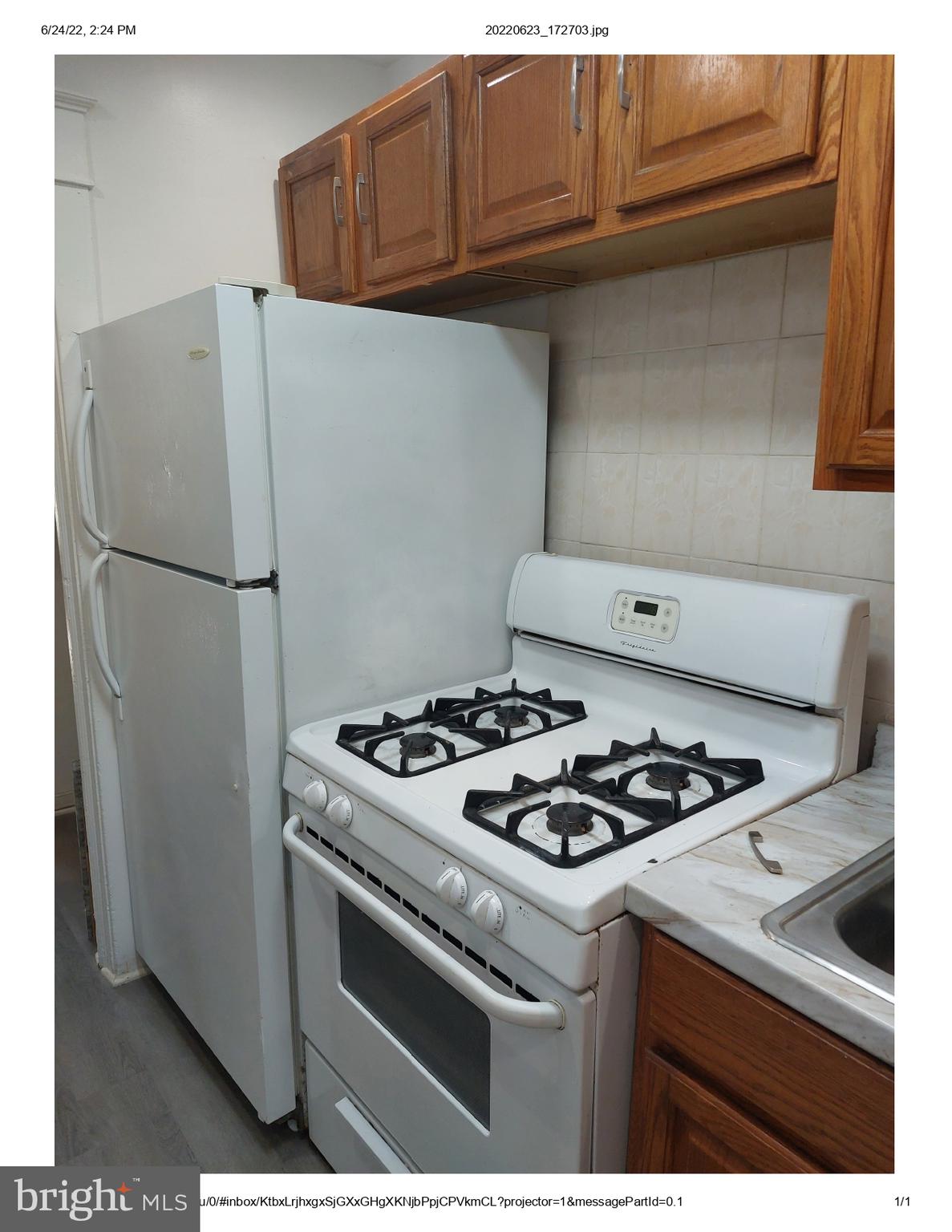 1 Madison Avenue, Unit B Mount Holly, NJ 08060 - Photo 6 of 15 a kitchen with a stove and a refrigerator