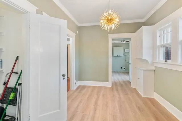 a view of a hallway with a chandelier