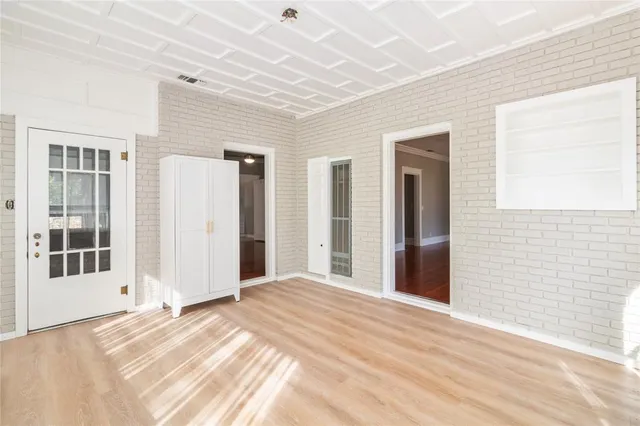 a view of a livingroom with wooden & and furniture