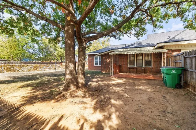 a backyard of a house with lots of green space