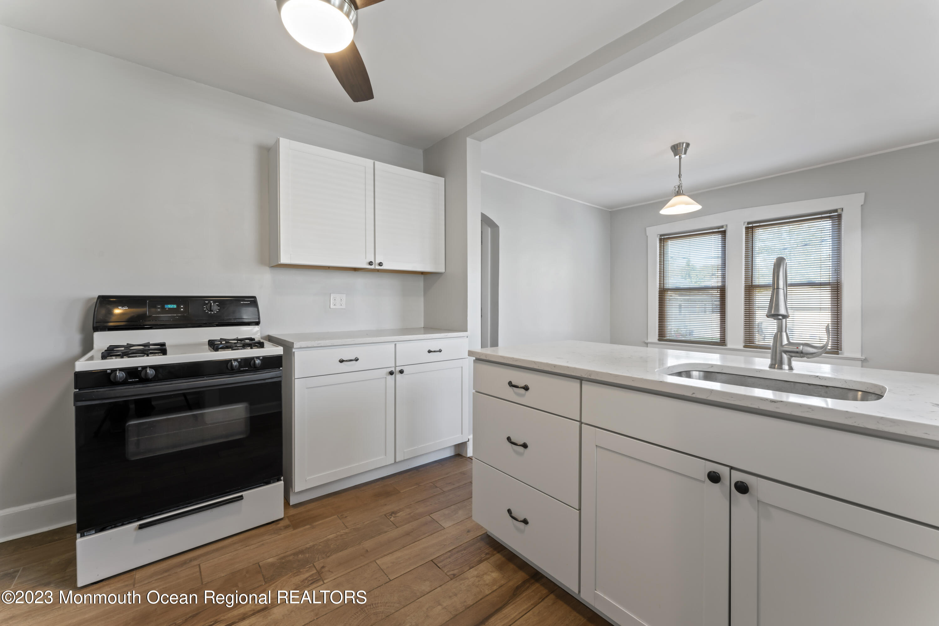 1302 B Street Belmar, NJ 07719 - Photo 16 of 42 a kitchen with appliances cabinets and a sink