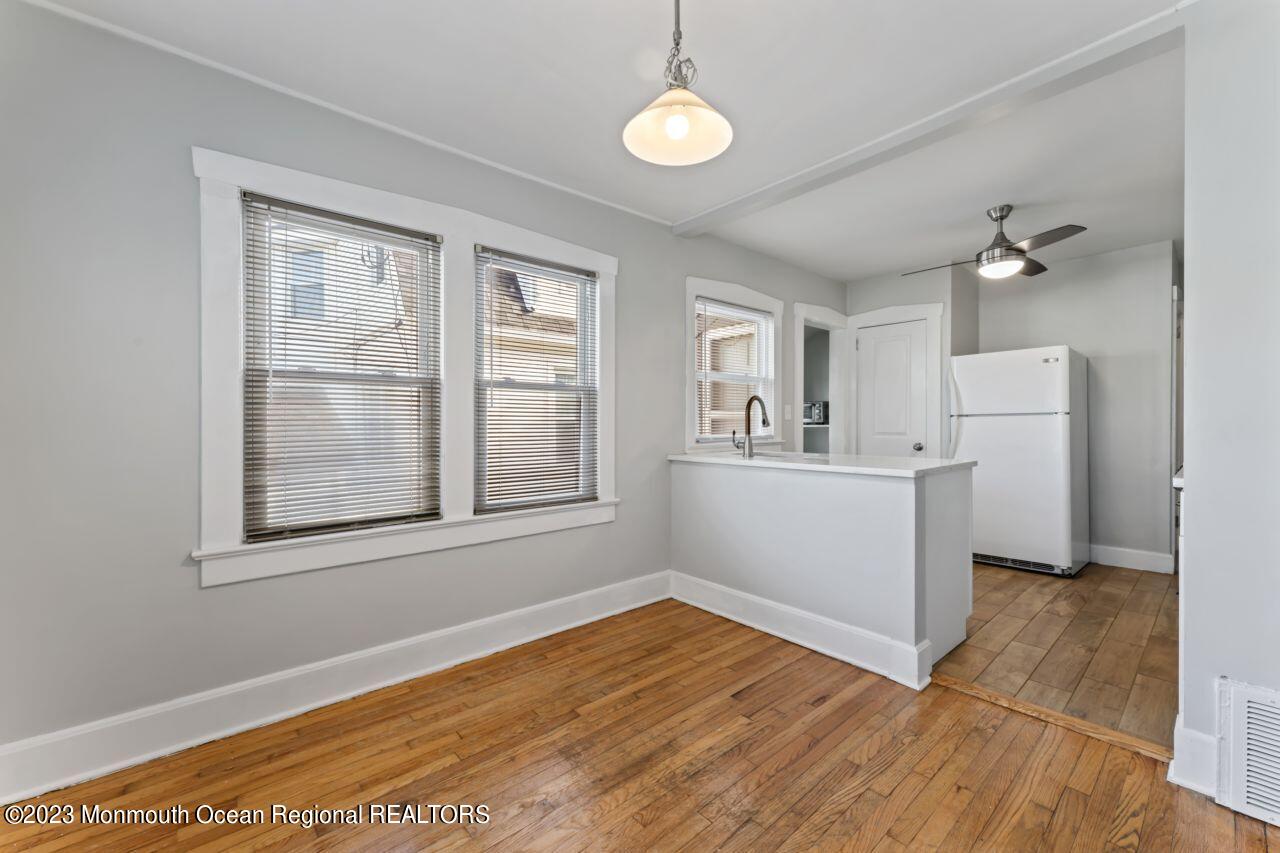 1302 B Street Belmar, NJ 07719 - Photo 33 of 42 a view of empty room with wooden floor and fan
