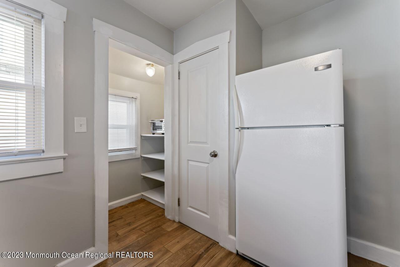 1302 B Street Belmar, NJ 07719 - Photo 35 of 42 a view of walk in closet with wooden floor