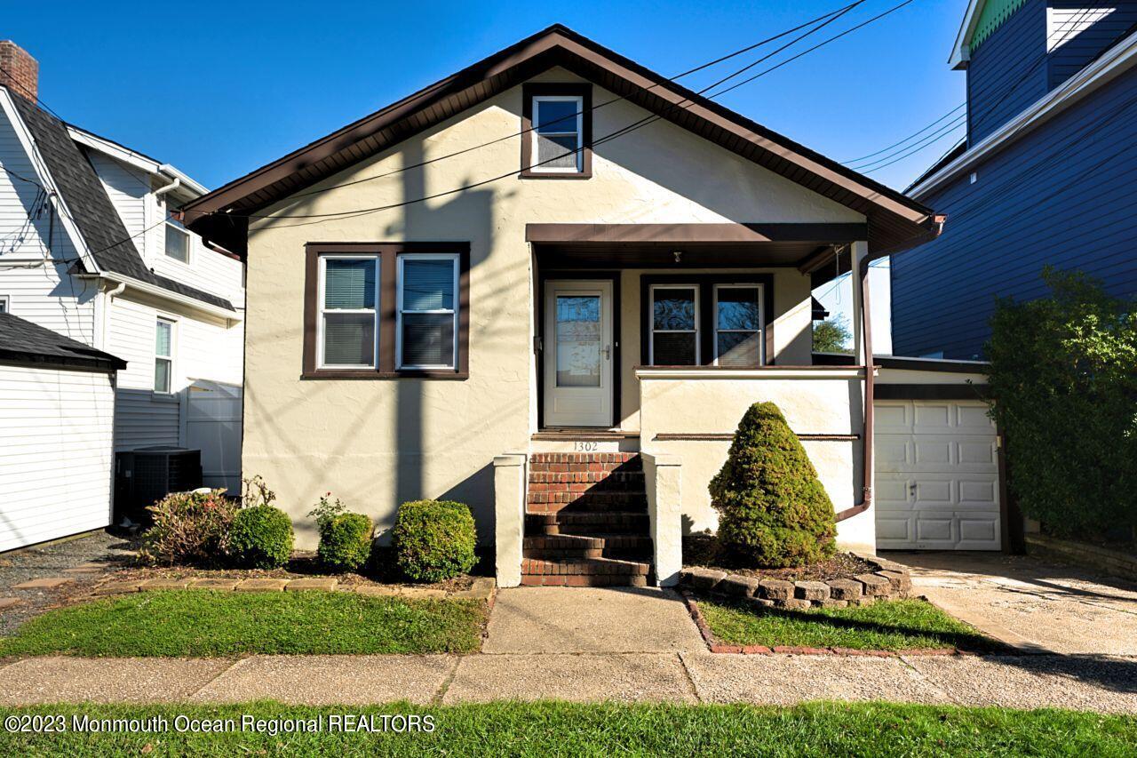 1302 B Street Belmar, NJ 07719 - Photo 40 of 42 a front view of a house with a yard