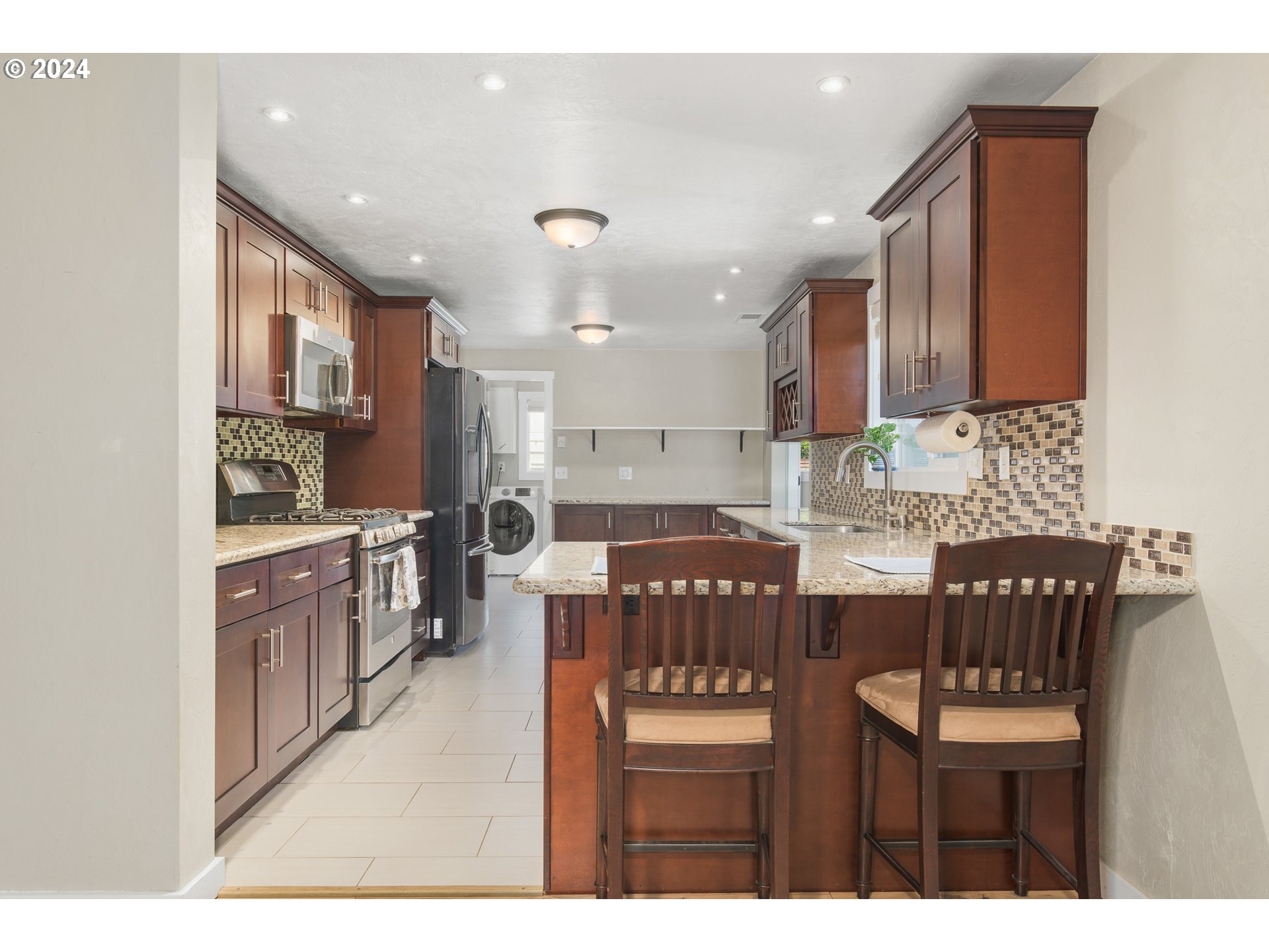 273 West Anchor Avenue Eugene, OR 97404 - Photo 11 of 43 a kitchen with a table chairs sink and cabinets