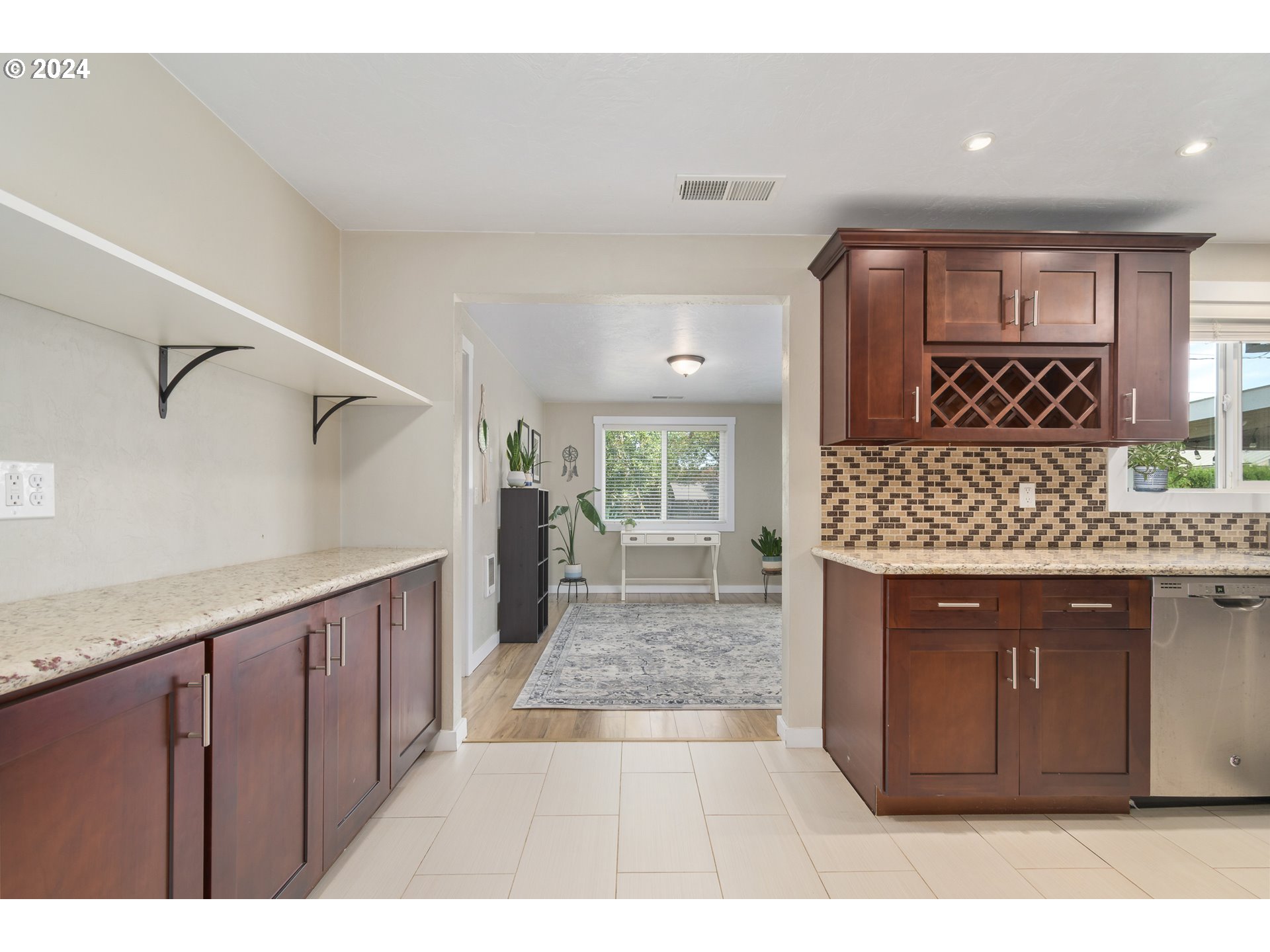 273 West Anchor Avenue Eugene, OR 97404 - Photo 15 of 43 a kitchen with stainless steel appliances granite countertop a sink and cabinets