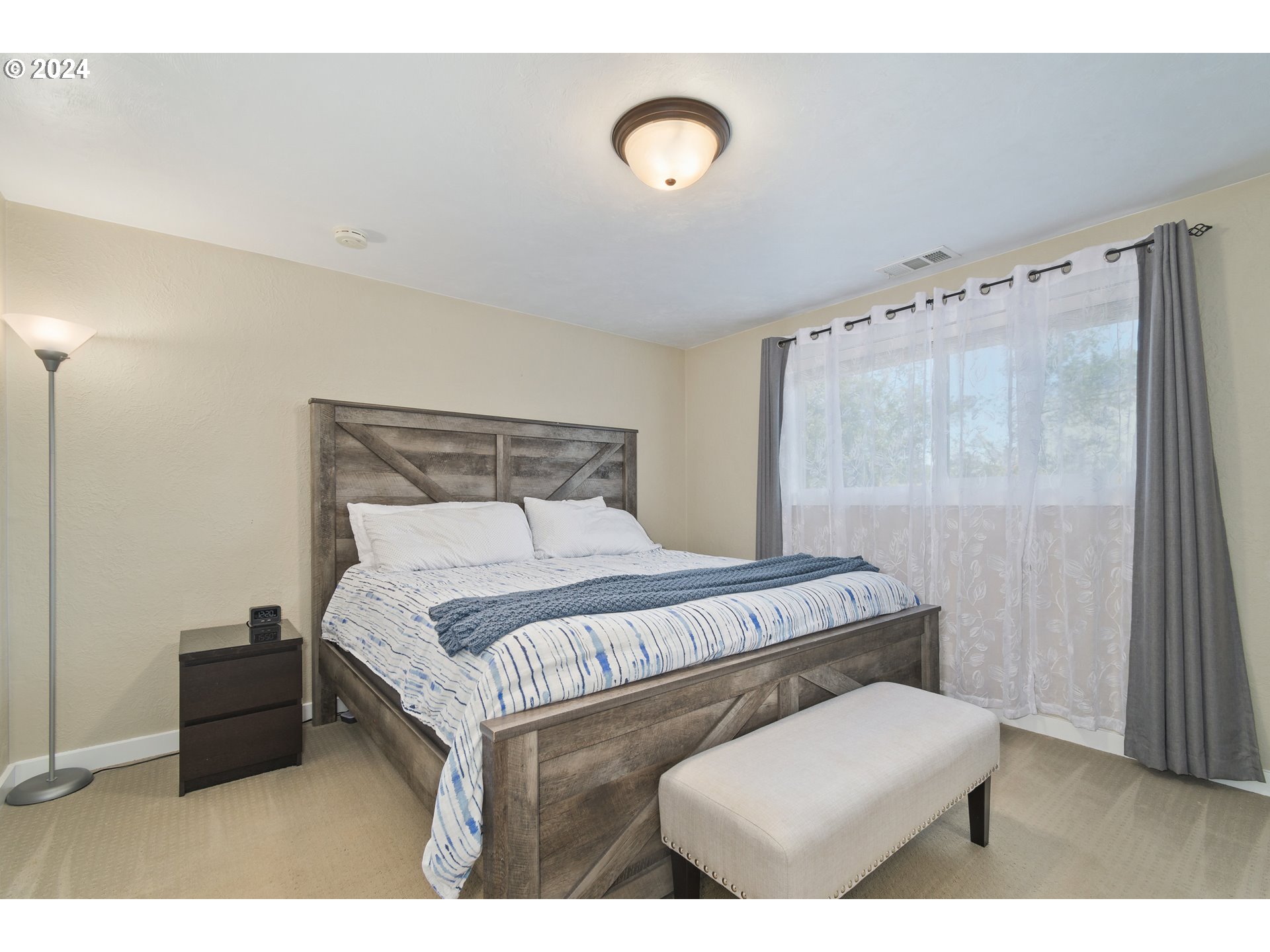 273 West Anchor Avenue Eugene, OR 97404 - Photo 23 of 43 a bedroom with a bed and a chair