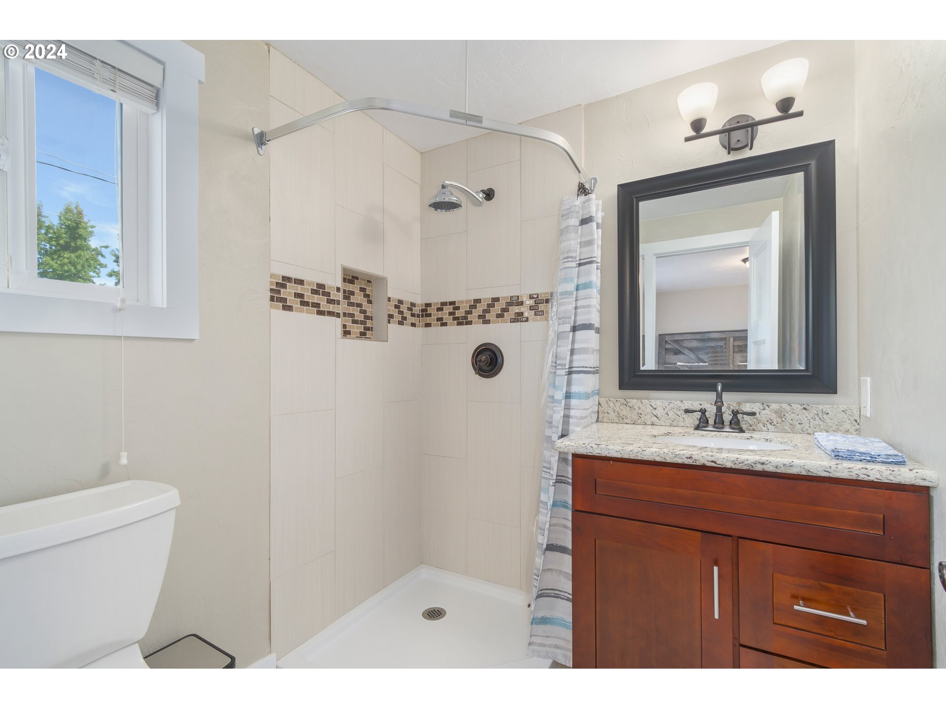 273 West Anchor Avenue Eugene, OR 97404 - Photo 25 of 43 a bathroom with a sink a toilet and a mirror