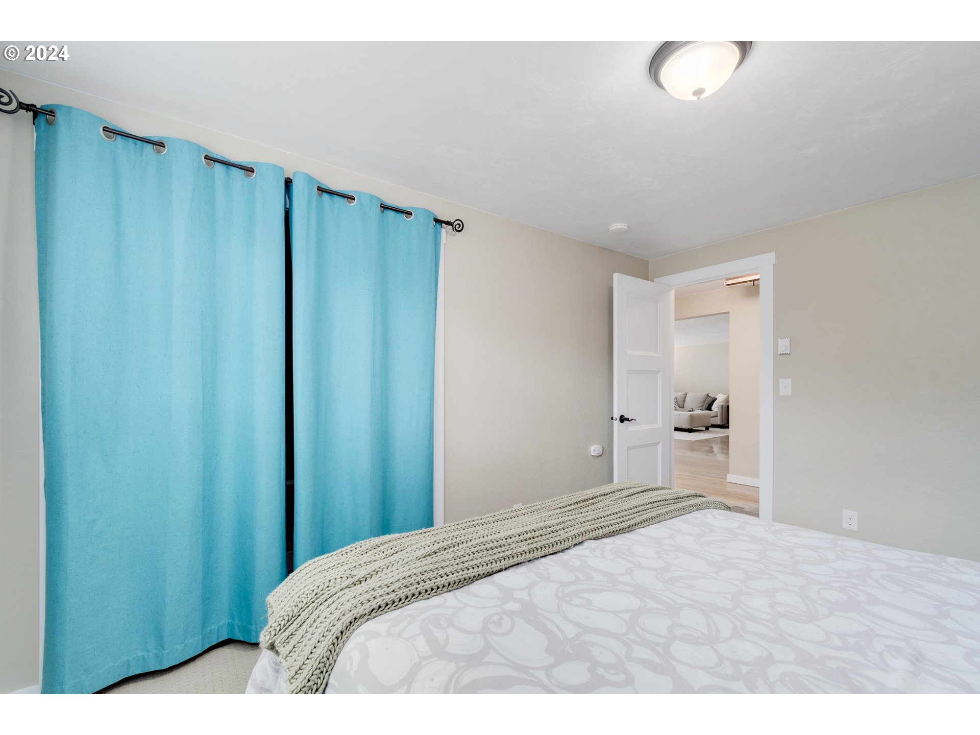 273 West Anchor Avenue Eugene, OR 97404 - Photo 28 of 43 a bedroom with a bed and a mirror