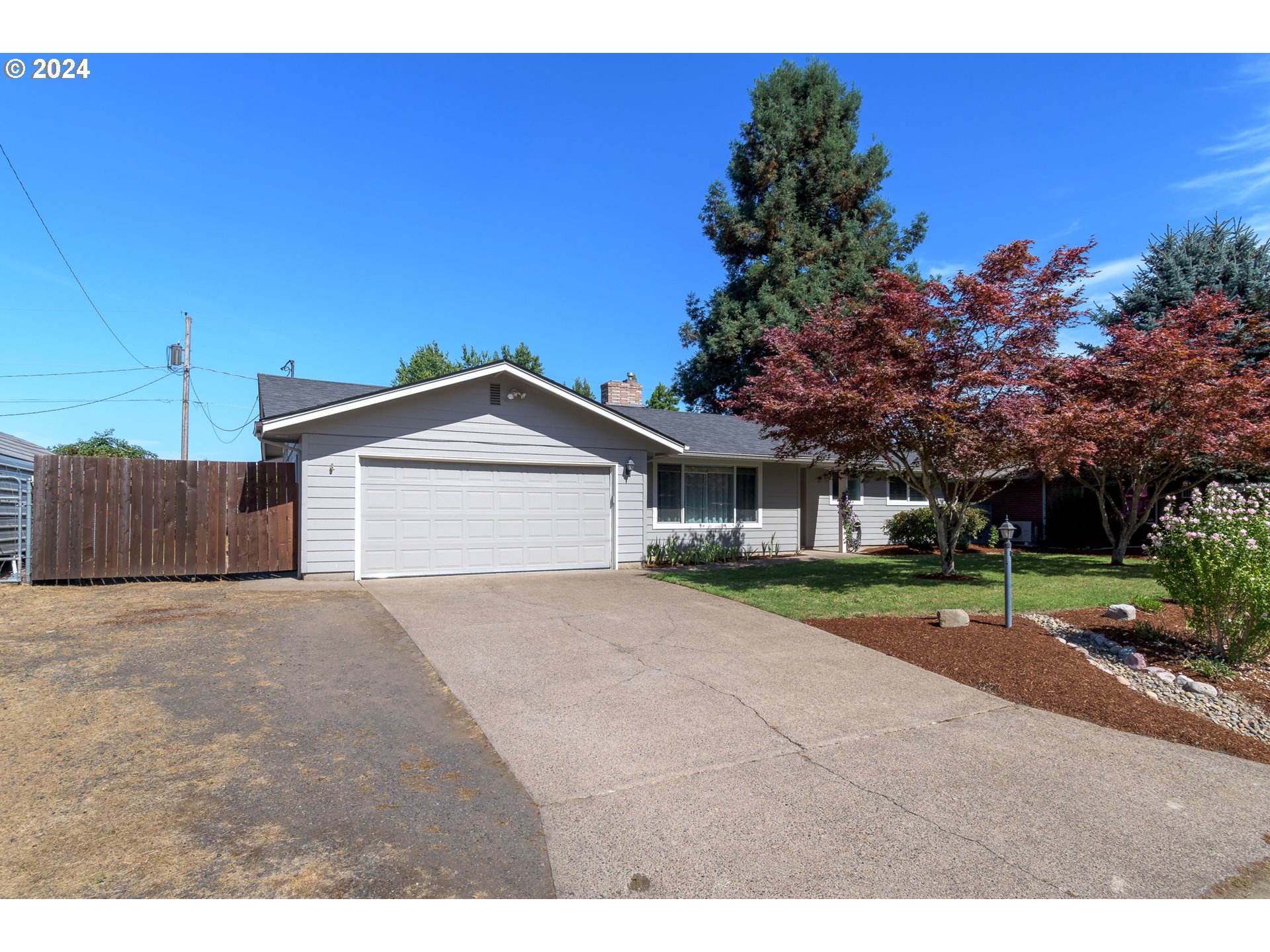 273 West Anchor Avenue Eugene, OR 97404 - Photo 3 of 43 a front view of a house with a yard and garage