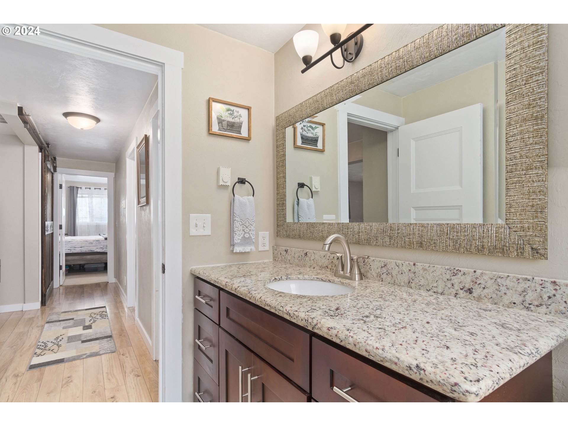 273 West Anchor Avenue Eugene, OR 97404 - Photo 32 of 43 a bathroom with a sink vanity granite and a mirror