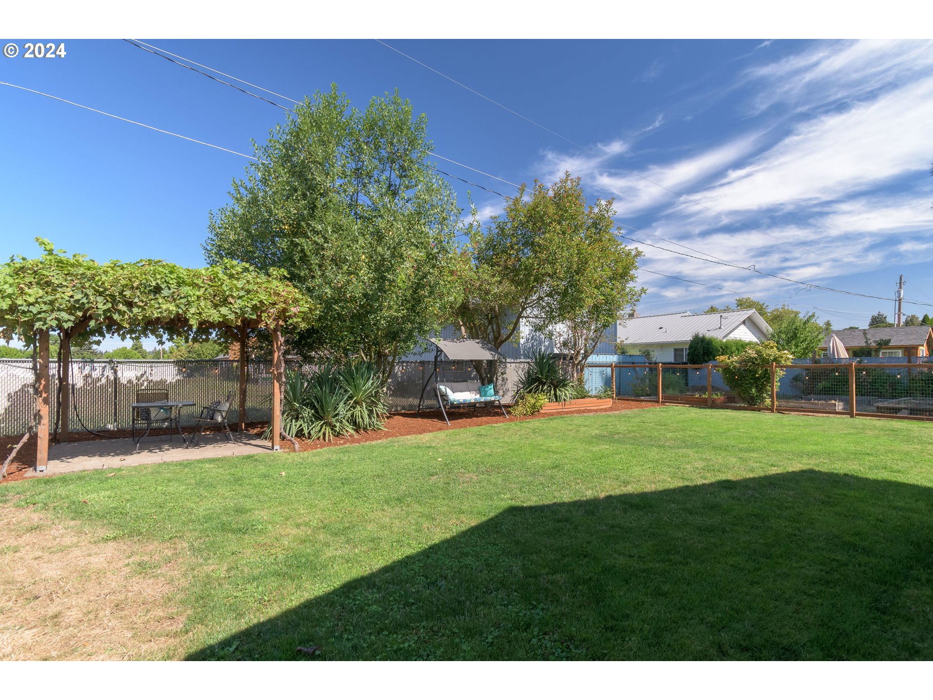 273 West Anchor Avenue Eugene, OR 97404 - Photo 35 of 43 a front view of a house with a yard