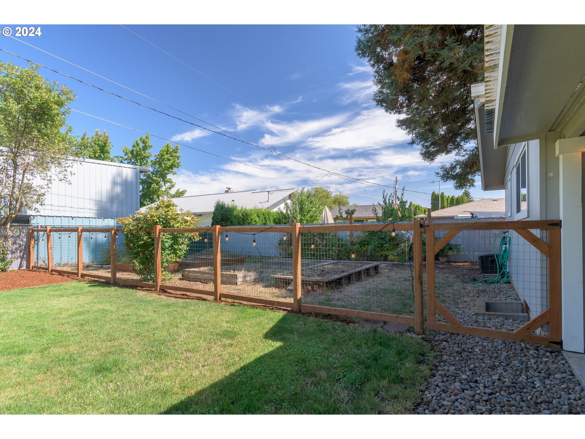 273 West Anchor Avenue Eugene, OR 97404 - Photo 39 of 43 a view of a backyard with couches plants and large tree